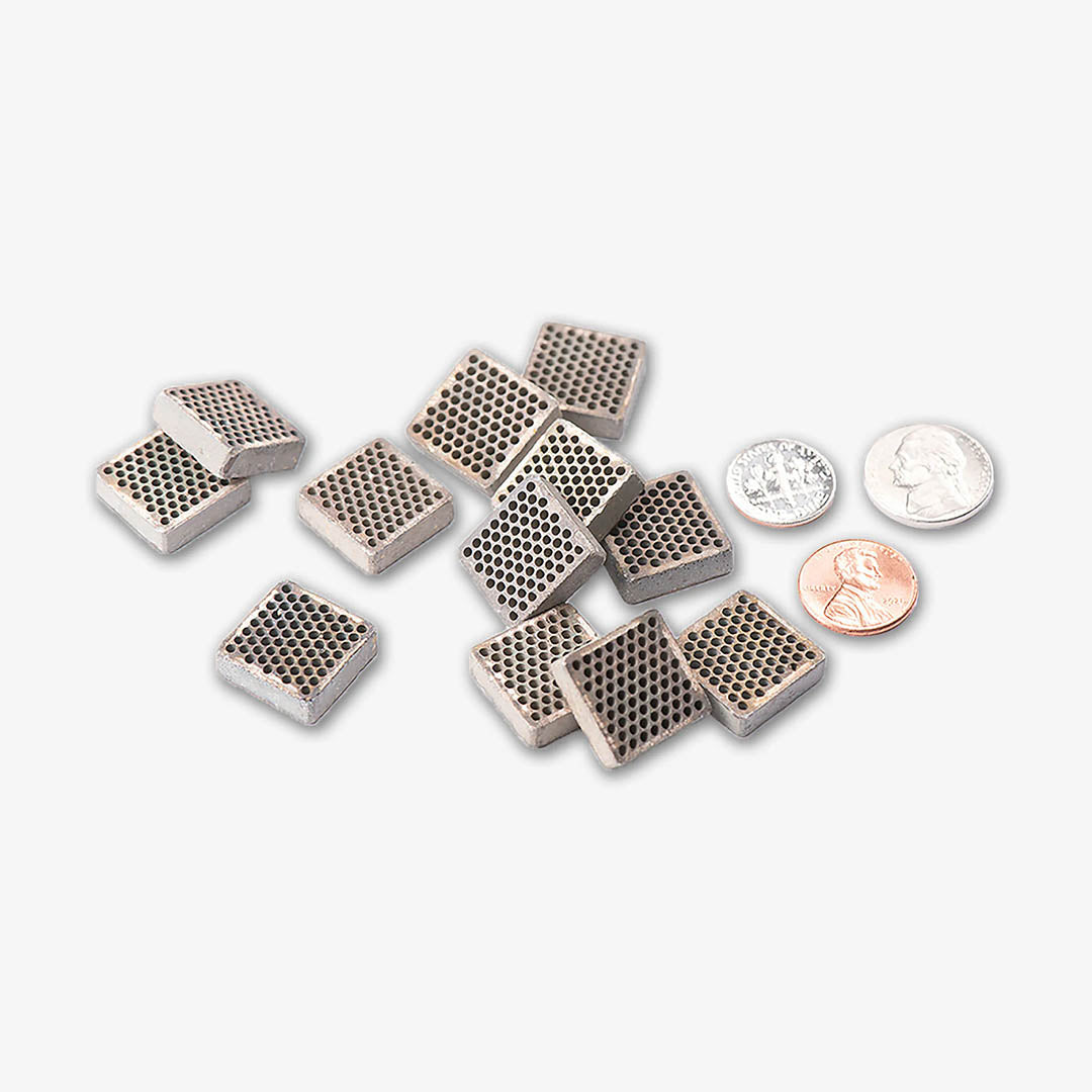 Relax Far Infrared Semiconductor Chips, shown with coins for scale on a white background
